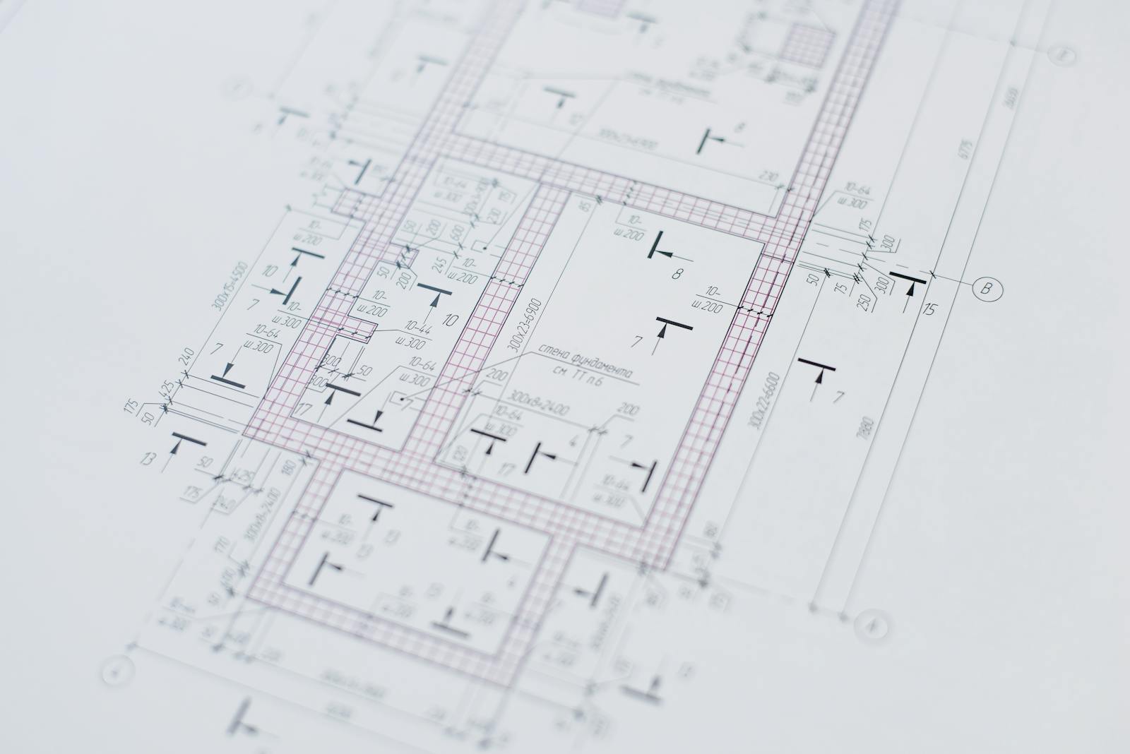 Architectural drawings and design tools on a desk.