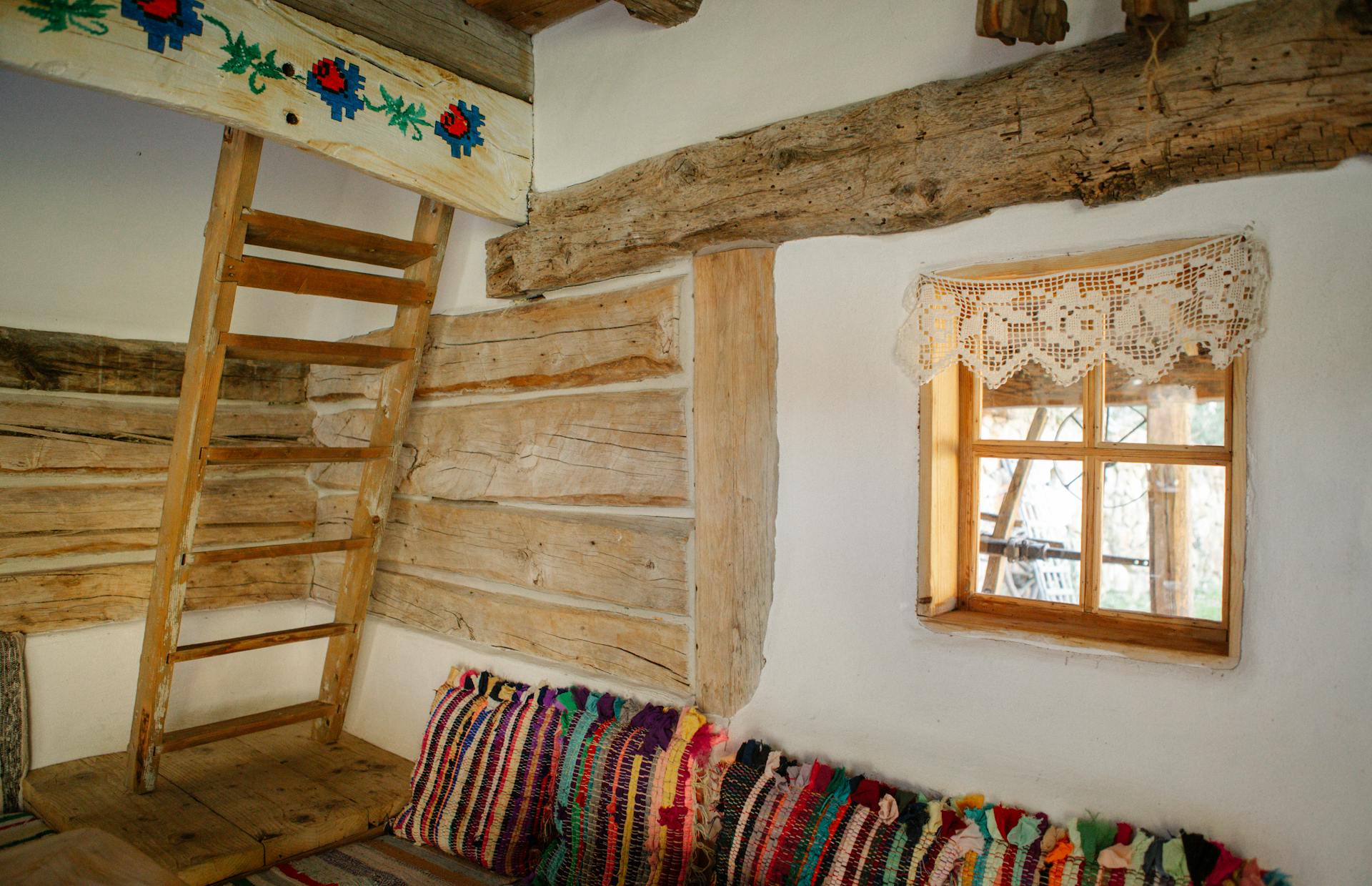 Kingfisher Barn interior — beams and textiles