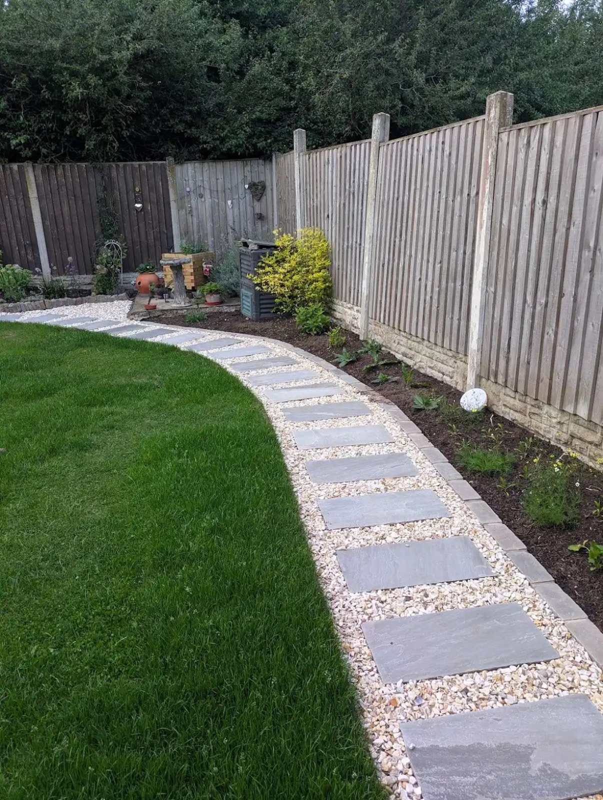Modern curved grey sandstone pathway built by Lazy Days