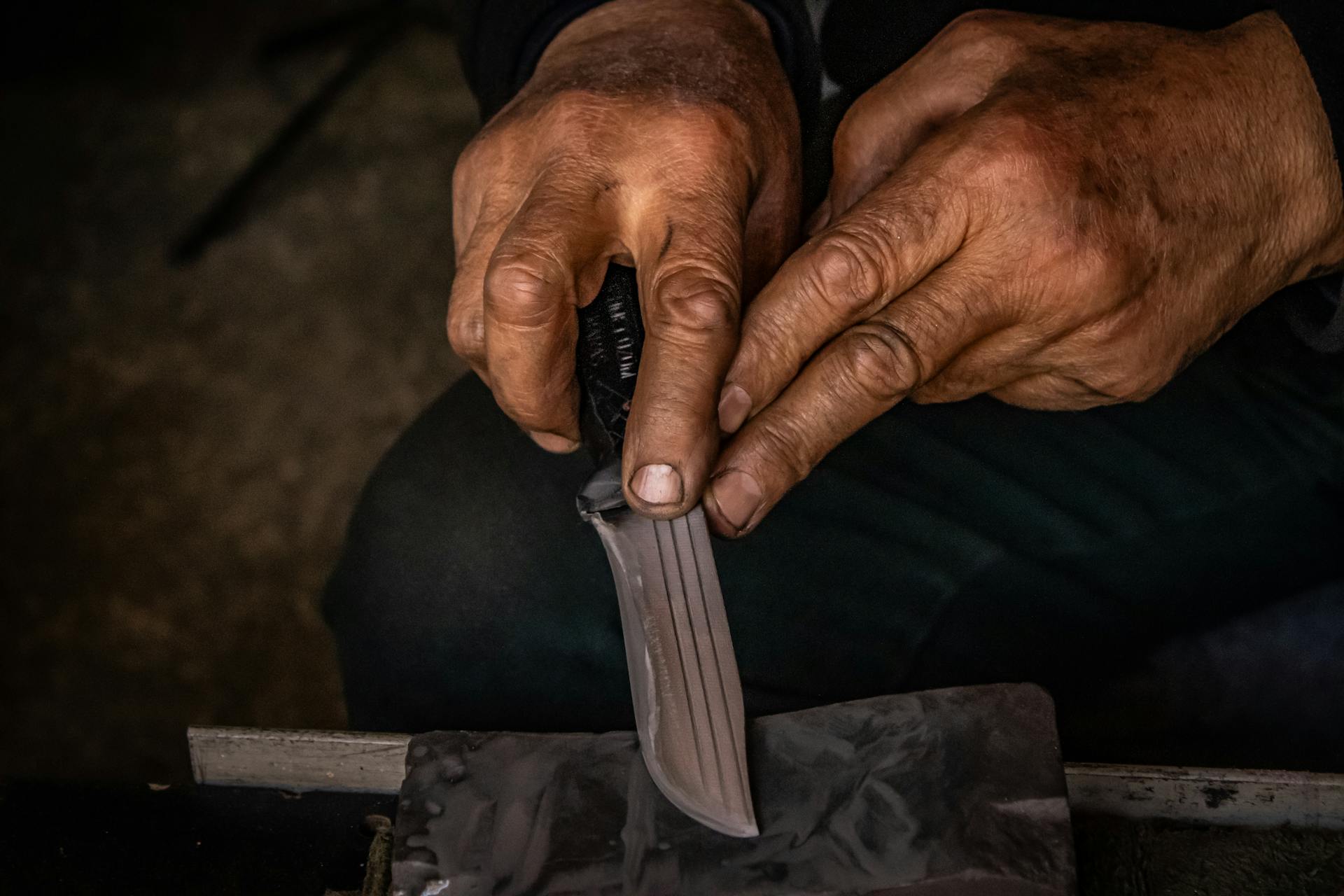 Hands at work on a waterstone