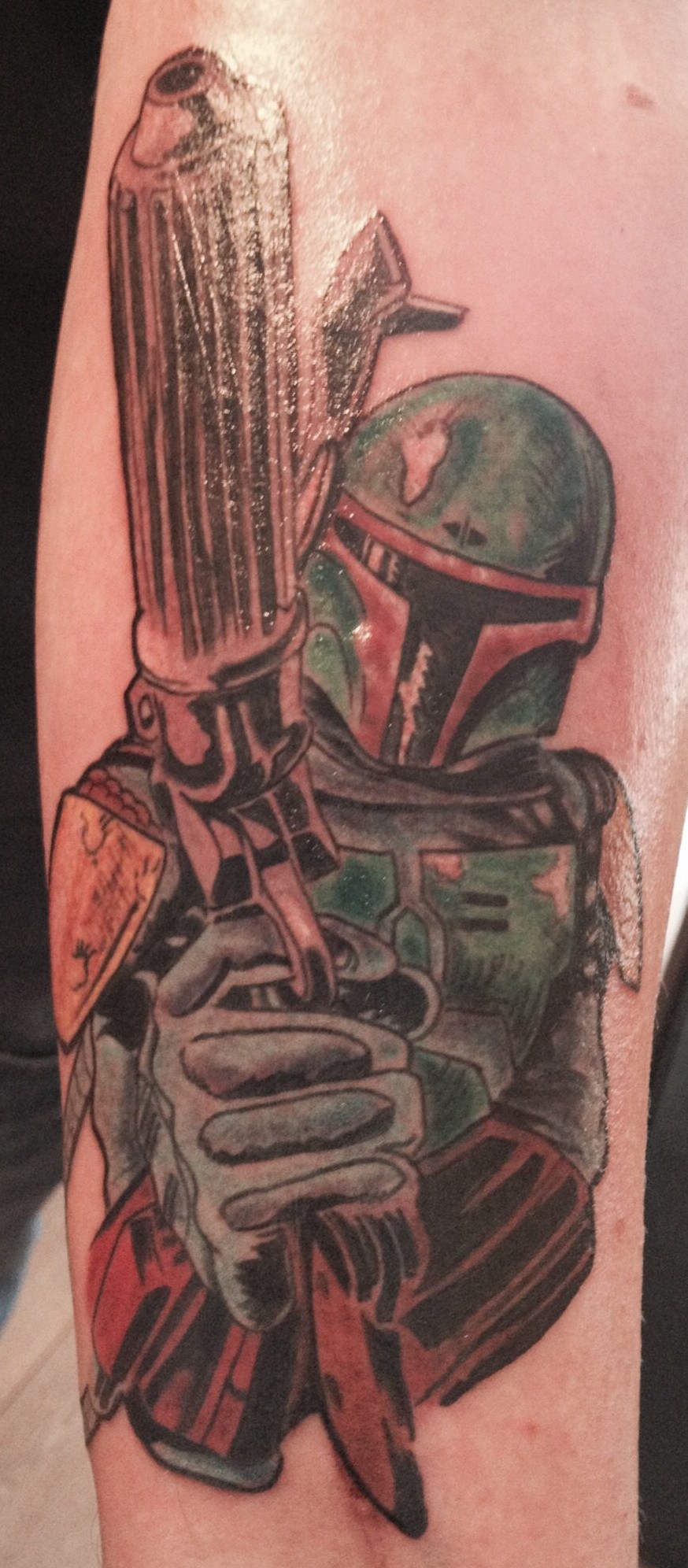 A colour illustrative tattoo of Boba Fett from Star Wars
